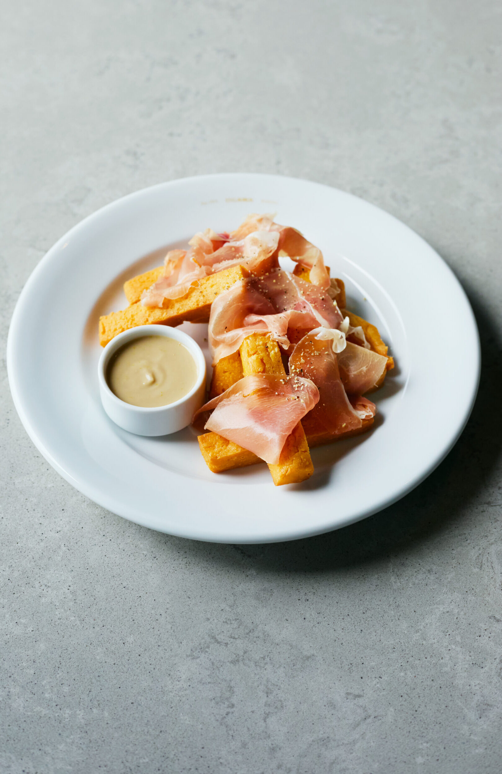 Panisse with Prosciutto and Anchovy Sauce