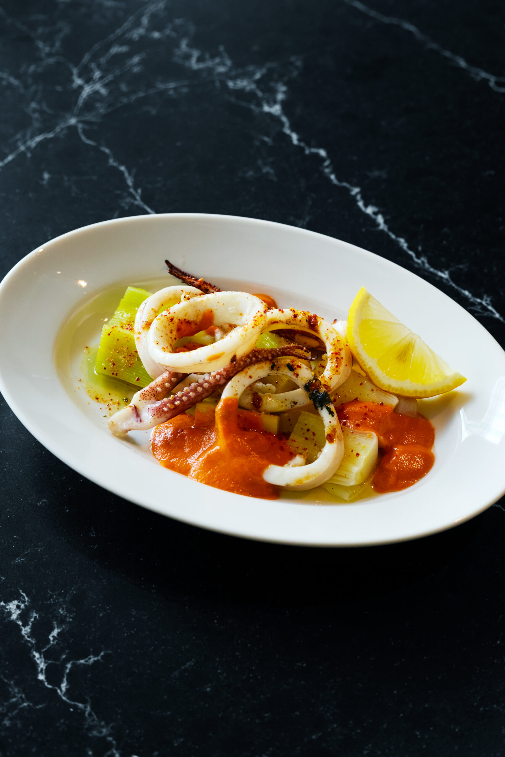 Catalan-Style Calcots and Charcoal‑Grilled Squid with Romesco Sauce
